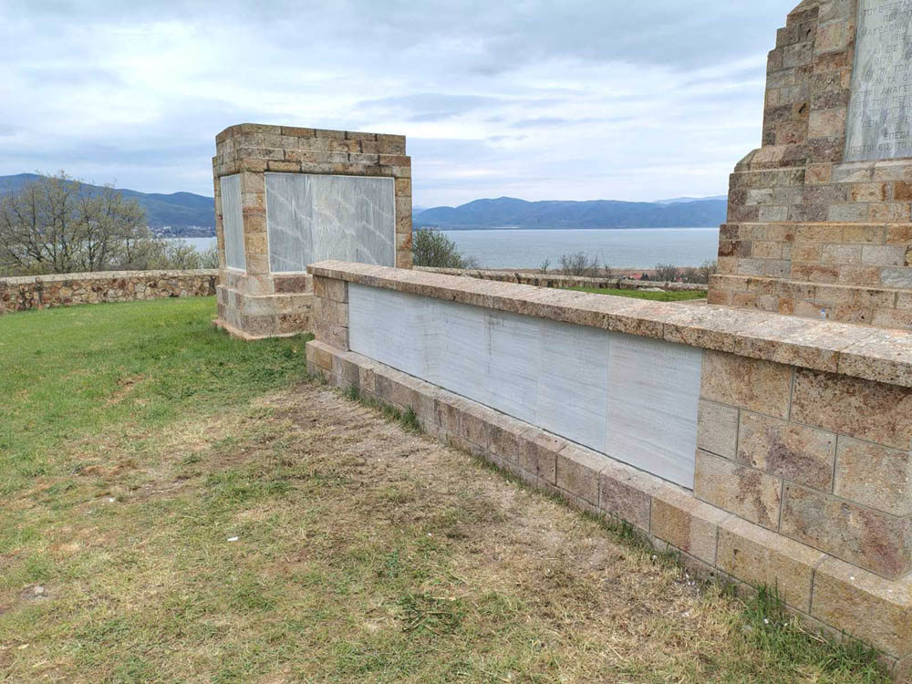 View of the Dorain Memorial curtain wall showing newly-insallted marble name panelset amongst brick masonry.