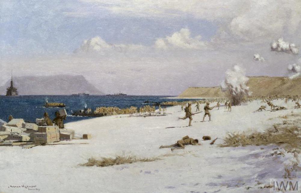 Paintng showing British troops running ashore at Suvla Bay, August 1915. Shippin can be seen in the background on the oily blue sea. Whisps of cloud have been painted swiling in a light blue sky. Shell bursts can be seen on the beach and in the air.